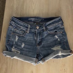 blue ripped denim shorts